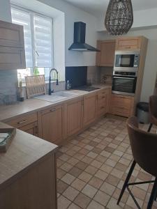 a kitchen with a sink and a stove top oven at Casa tanghicciola in Levie