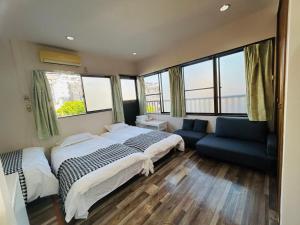 Ένα ή περισσότερα κρεβάτια σε δωμάτιο στο Ueno Iriya Hotel