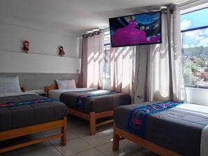 Letto o letti in una camera di HOSTAL La RASA