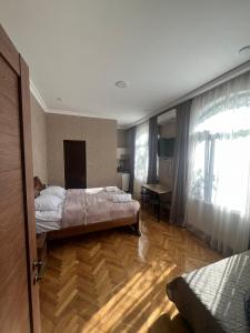 Voodi või voodid majutusasutuse Shota's Guest House toas
