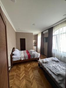 Voodi või voodid majutusasutuse Shota's Guest House toas