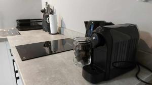 a coffee machine sitting on top of a counter at Apartment Dąbrówka 10 in Cieplice Slaskie Zdroj