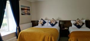Letto o letti in una camera di Arnolds Hotel