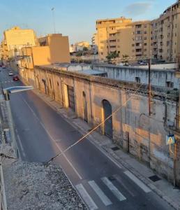 an old building on the side of a city street at Home 22 in Brindisi
