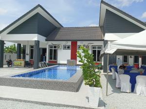 a rendering of a house with a swimming pool at Tokmabah Homestay in Ketereh