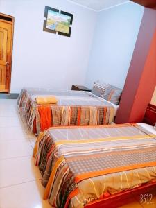 Llit o llits en una habitació de Confort Pichanaki