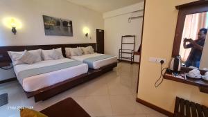 Letto o letti in una camera di Quick Stop Inn