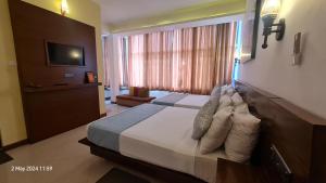 Letto o letti in una camera di Quick Stop Inn