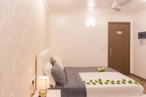 Postel nebo postele na pokoji v ubytování SIS Tourist Villa, Mathiveri, Maldives