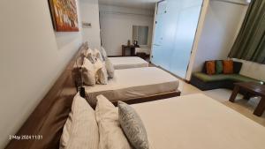 Letto o letti in una camera di Quick Stop Inn