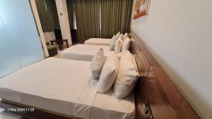 Letto o letti in una camera di Quick Stop Inn