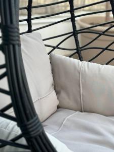 a black and white bed with white pillows on it at Ulivi di Minerva - Boutique Holiday Home - SUPER SUITE & SPA POLLON - Ostuni - Fasano - Cisternino in Montalbano