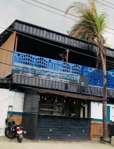 a motorcycle parked in front of a blue moon hotel at Blue Moon Hotel Victoria Island in Lagos +27 photos