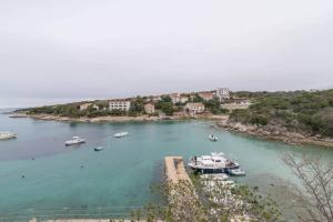 a group of boats docked in a body of water at Blue Lagoon in Potocnica +14 photos