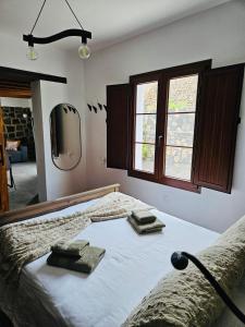 a bedroom with a bed with two towels on it at Casa Celi in Teguise