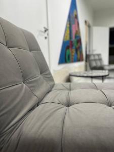 eine Nahaufnahme einer Couch in einem Wohnzimmer in der Unterkunft Ulivi di Minerva - Boutique Holiday Home - Apartment ZEUS - Ostuni - Fasano - Cisternino in Montalbano
