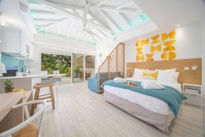 Voodi või voodid majutusasutuse Cocoonhuts Résidences Martinique toas