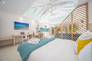 Postel nebo postele na pokoji v ubytování Cocoonhuts Résidences Martinique + 37 fotografií