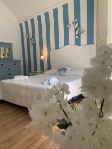 A bed or beds in a room at La Zagara B&B