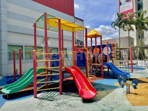 a playground with a slide and a slide at 9am-5pm, SAME DAY CHECK IN AND CHECK OUT, Work From Home, Shaftsbury-Cyberjaya, Comfy Home by Flexihome-MY in Cyberjaya