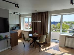 Η κουζίνα ή μικρή κουζίνα στο Horizont River View Apartment
