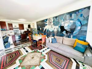 a living room with a couch and a table at HOSTEL ART & JOY in Pula