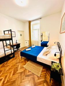 a bedroom with a bed and a desk in a room at HOSTEL ART & JOY in Pula