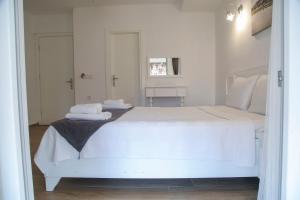 A bed or beds in a room at LONDİA OTEL