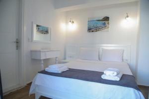 A bed or beds in a room at LONDİA OTEL