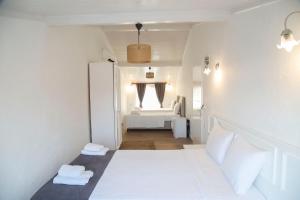 A bed or beds in a room at LONDİA OTEL