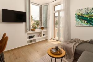 a living room with a couch and a table at Apartment Mama Marija in Hvar