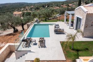 an image of a swimming pool at a house at Luxury Stone Villas Kefalonia in Trapezaki