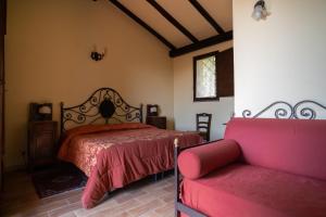 a bedroom with a bed and a couch at Borgata Baldazza in Linguaglossa +56 photos