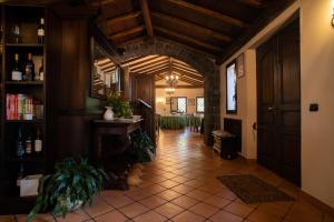 a hallway of a house with a room with a table at Borgata Baldazza in Linguaglossa