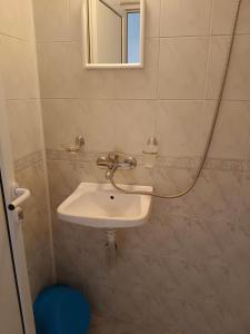 a bathroom with a sink and a mirror at Стаи за гости Ники in Nesebar +64 photos