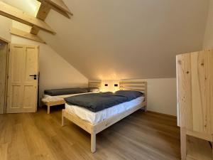 Postel nebo postele na pokoji v ubytování Apartmány a chata MONTANUS