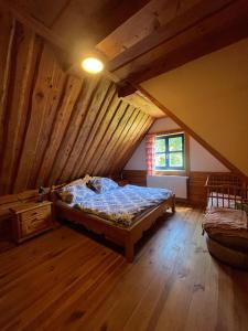 a bedroom with a bed in a attic at Chata Valika Jezersko in Jezersko