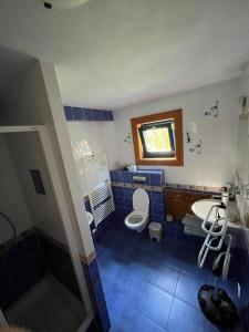 a bathroom with a sink and a toilet and a sink at Chata Valika Jezersko in Jezersko