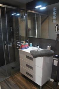 a bathroom with a sink and a shower at Atico A in Salou