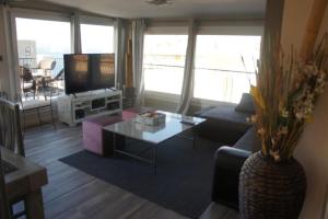 a living room with a couch and a table at Atico A in Salou