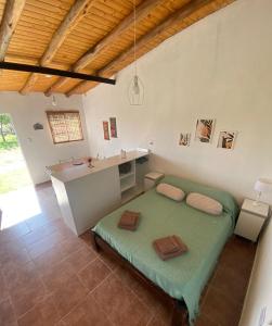 En eller flere senge i et værelse på Departamento en San Rafael, Mendoza