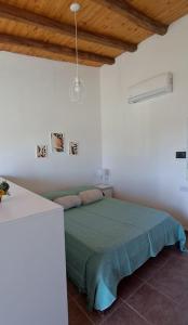 En eller flere senge i et værelse på Departamento en San Rafael, Mendoza