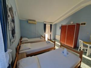 Postel nebo postele na pokoji v ubytování Pool Apartments Knežević