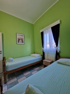 Postel nebo postele na pokoji v ubytování Pool Apartments Knežević