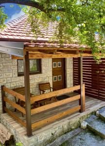 a wooden deck in front of a house at Skadar Lake Apartment Nikola I in Virpazar