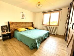 Voodi või voodid majutusasutuse Appartement 4-6 personnes, vue lac toas