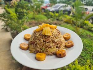 a plate of food with potatoes on it at Habitaciones con vista al infinito en Fundo Onírica in Tarapoto