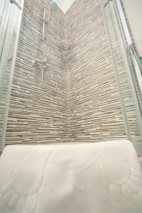 a bathroom with a shower with a bed in it at Adriatic Escape Novalja-Zrce! in Novalja +46 photos