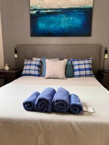 a group of blue towels sitting on top of a bed at Buenos Aires, Recoleta, Capital Federal in Buenos Aires