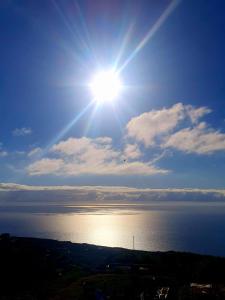 a sun shining over a body of water at El gato genial in Santa Cruz de Tenerife